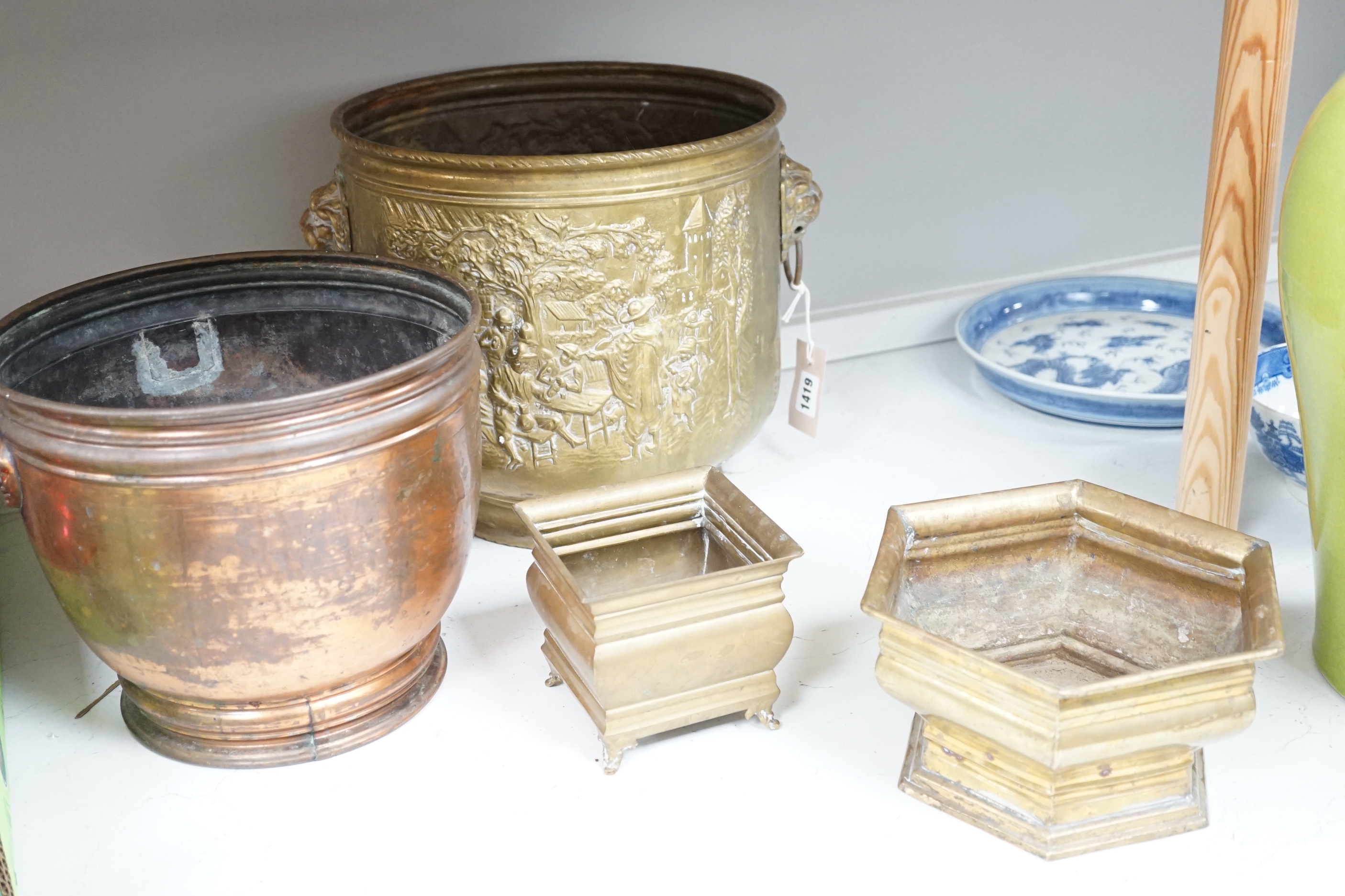 A group of metalware including two jardinieres, two brass dishes, a brass horses, head tray, a bronze of two jockeys on horseback and a bronze of a seated horse, tallest jardiniere 29cm